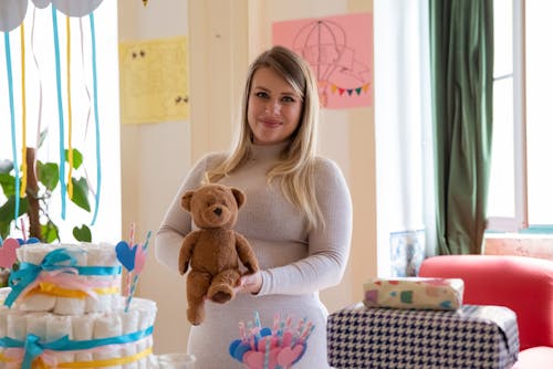 Free Woman Holding a Brown Teddy Bear Stock Photo