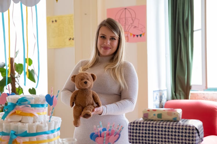 Woman Holding A Brown Teddy Bear