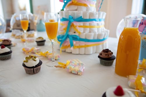 Free Cupcakes on White Table Cloth Stock Photo