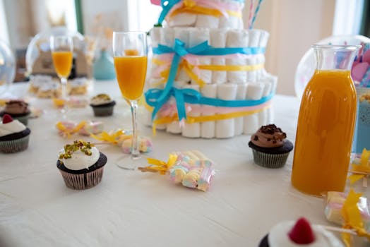 Cupcakes on White Table Cloth - baby shower at restaurant ideas