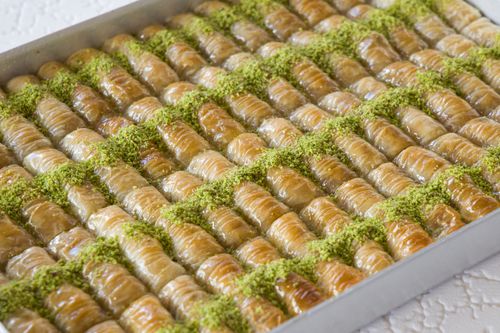 Free Close-up of traditional Turkish baklava with pistachio garnish, showcasing sweet indulgence. Stock Photo