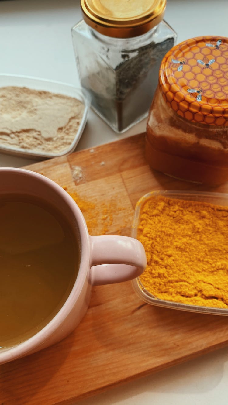 Ground Turmeric And Ginger Near Broth