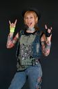 Woman Wearing Denim Vest Posing with Her Tongue Out