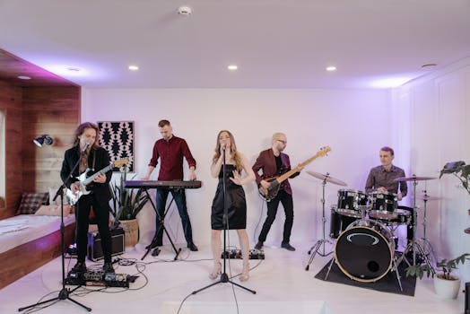 A dynamic band performing indoors with guitar, drums, and vocals.