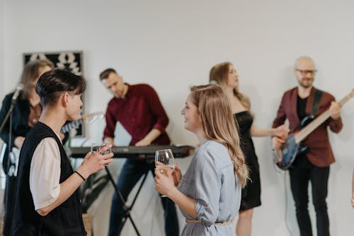 Man and Woman Talking while at the Party