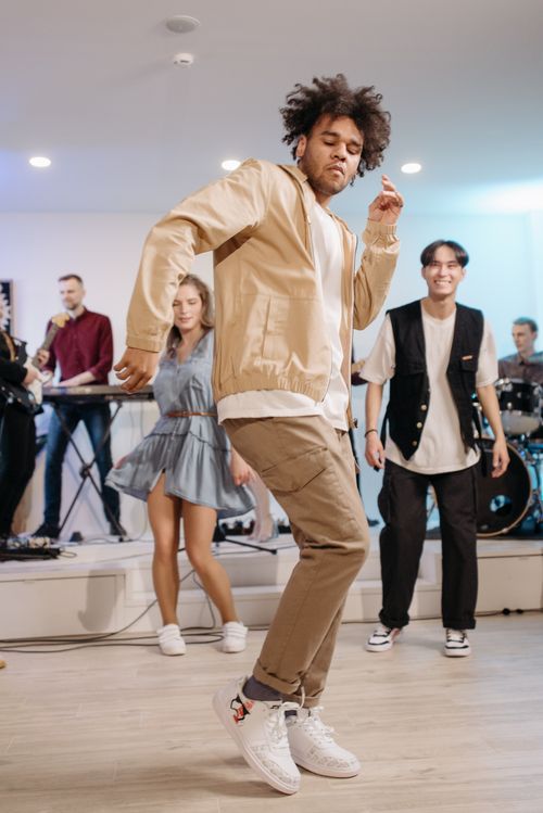 Free Vibrant indoor dance party featuring cheerful people and live music band. Stock Photo