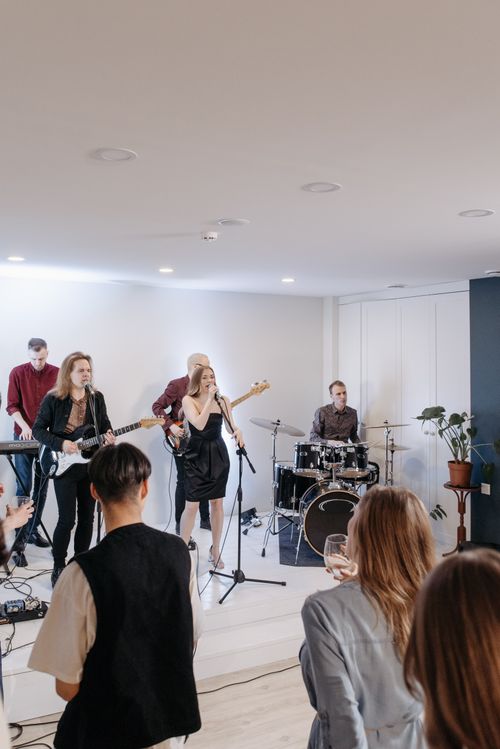 Free A lively concert with band performing indoors, engaging audience. Stock Photo