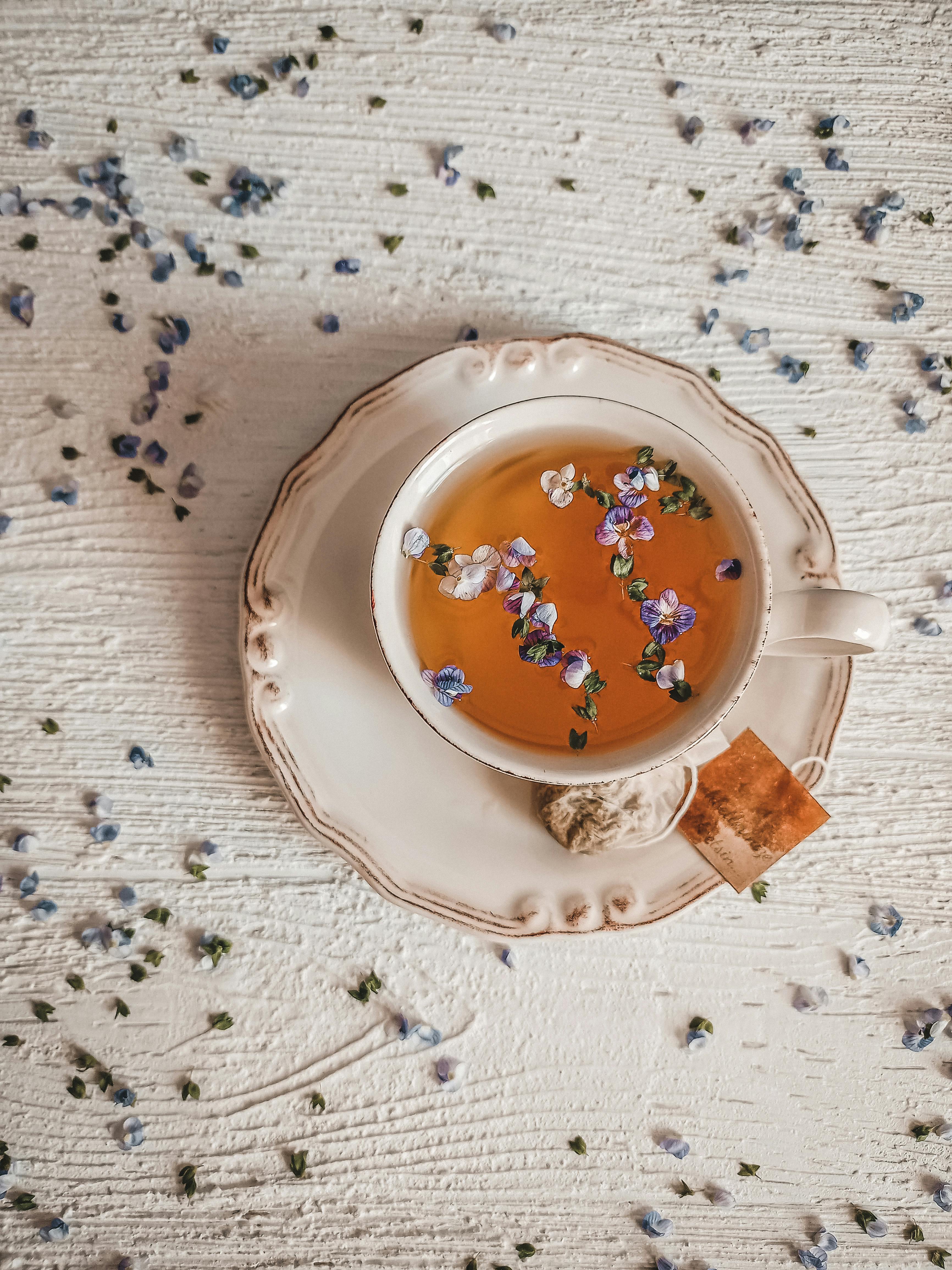 a top shot of a tea with flowers