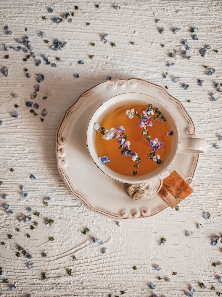 A Top Shot Of A Tea With Flowers