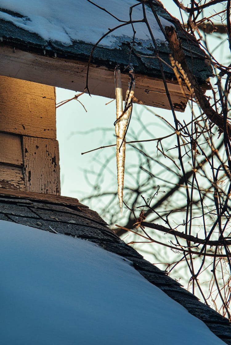 
An Icicle Attached To A Roof