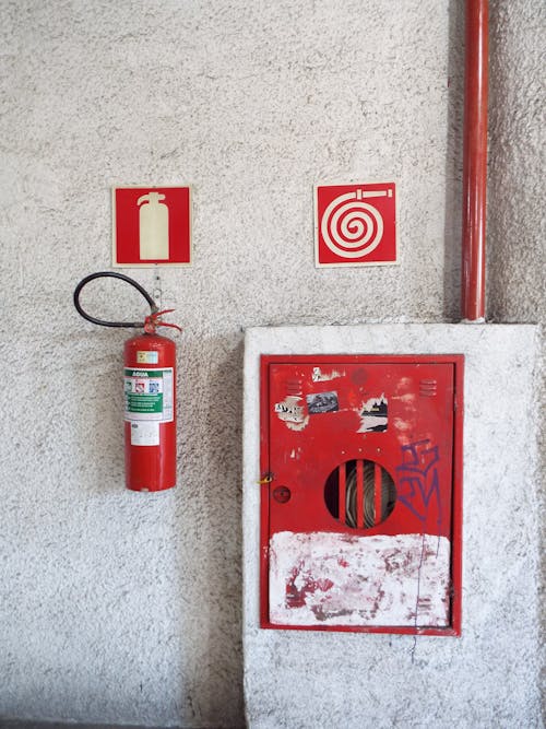 Free Mounted Fire Extinguisher on the Wall Stock Photo