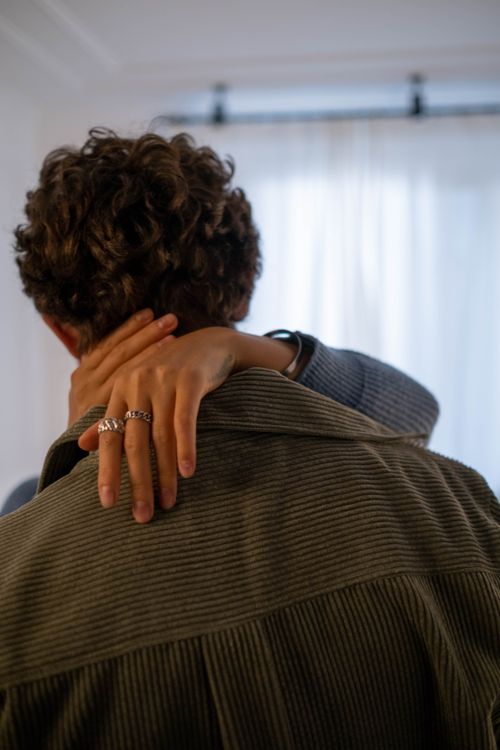 Free A couple sharing a loving embrace indoors, highlighting intimacy and connection. Stock Photo