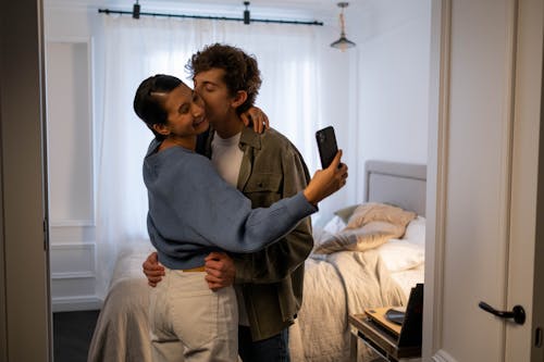 Free Woman Taking a Selfie with Her Boyfriend Stock Photo