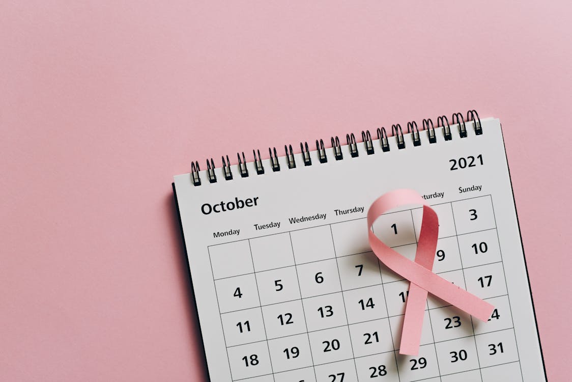 White and Black Calendar on Pink Wall