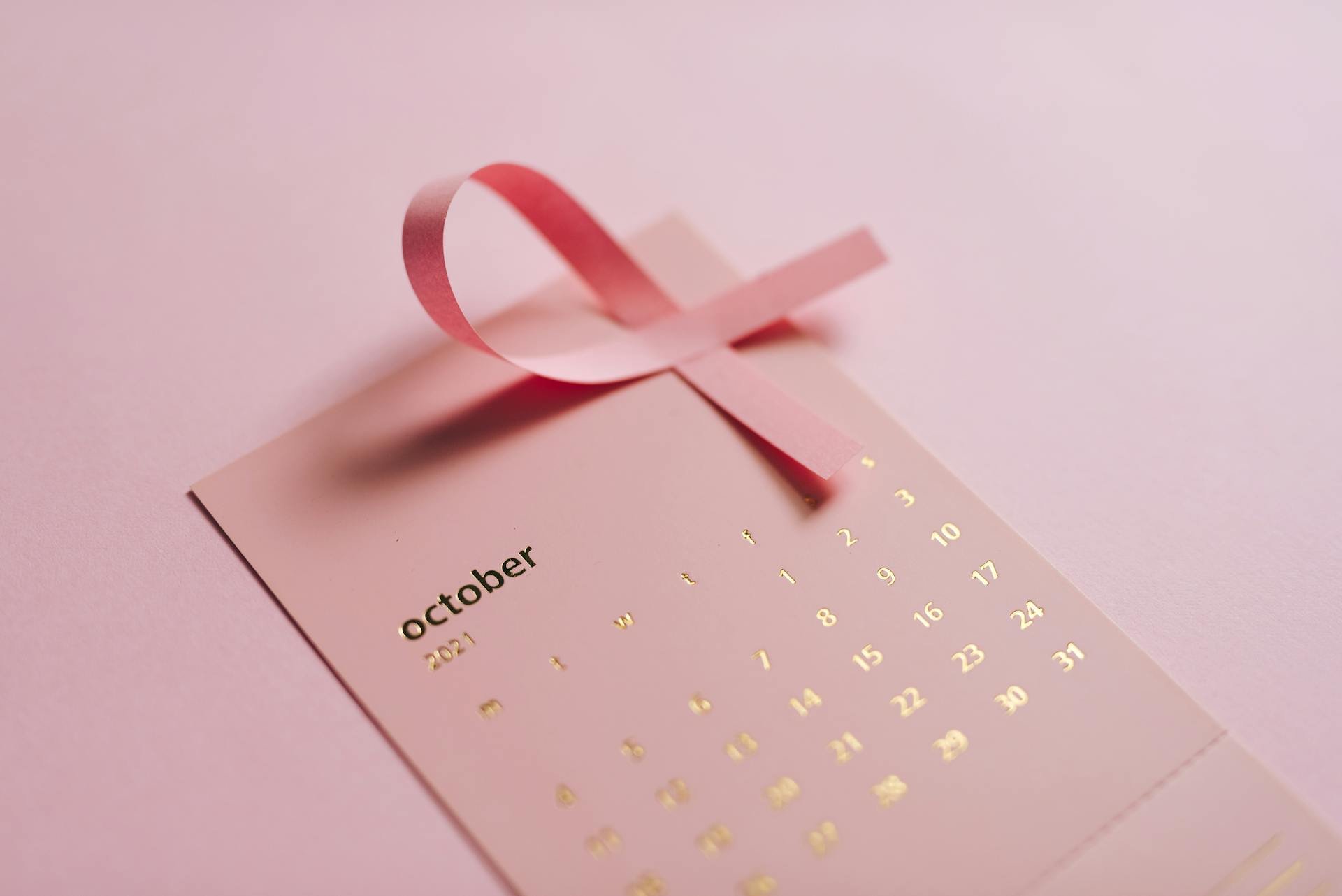 Close-up Shot of Pink Calendar