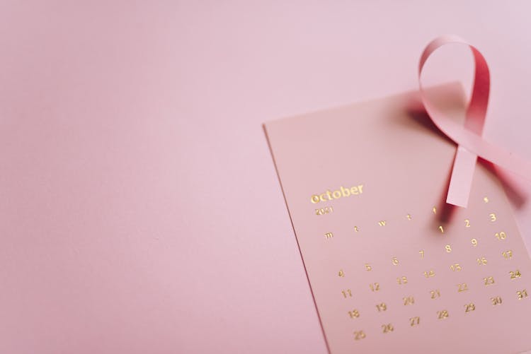 Close-Up Shot Of A Pink Ribbon On A Calendar