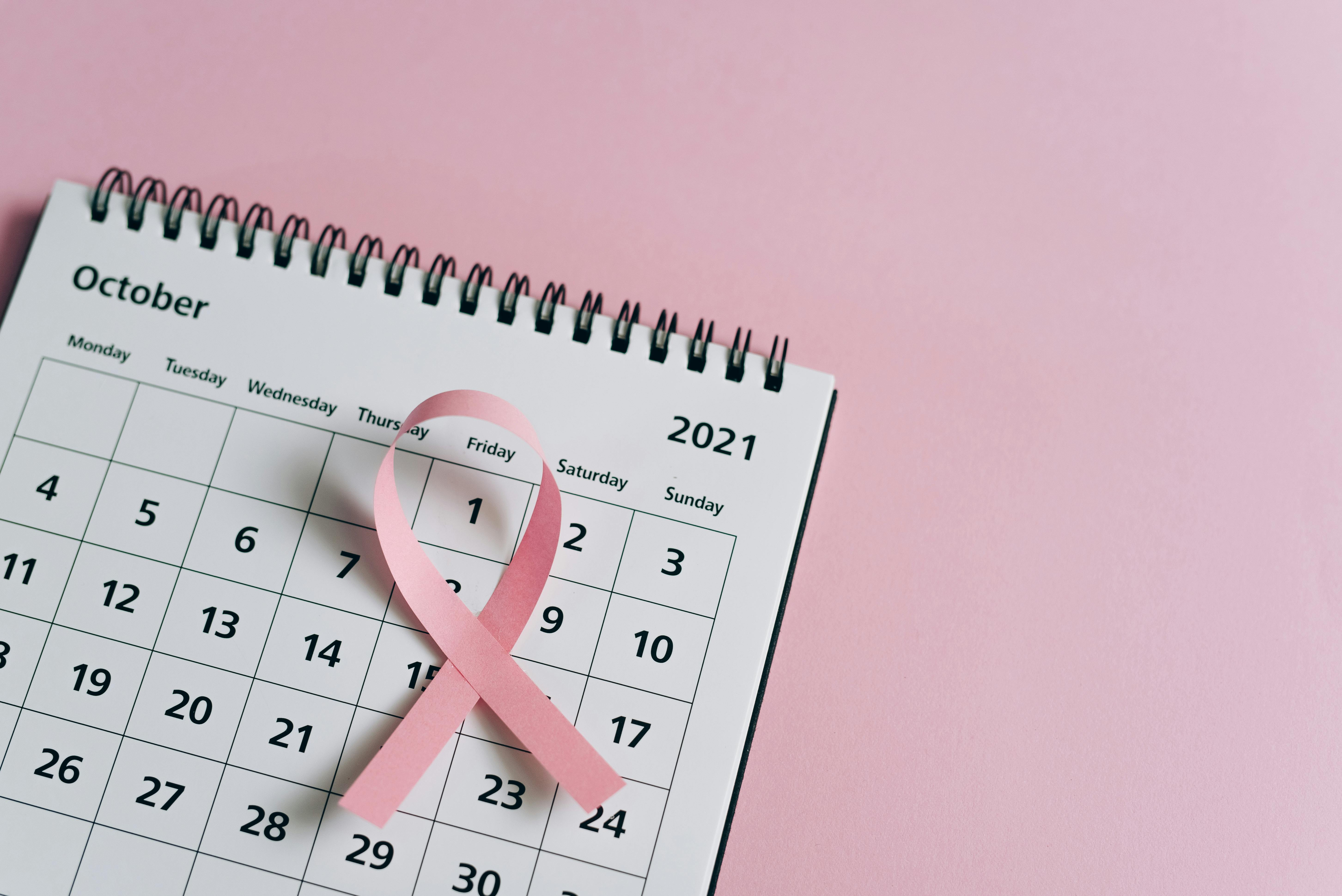 a pink ribbon on a calendar