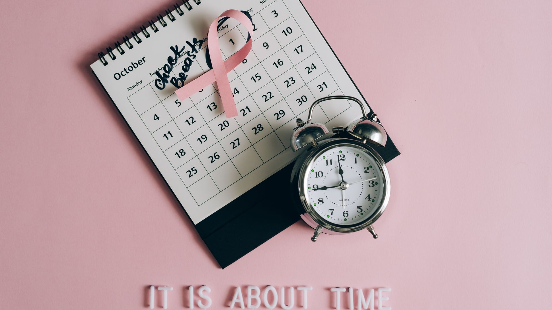 modafinil tolerance break schedule: The Ultimate Guide Calendar with pink ribbon, an alarm clock, and the text "Check breasts" signifies Breast Cancer Awareness — modafinil tolerance break schedule