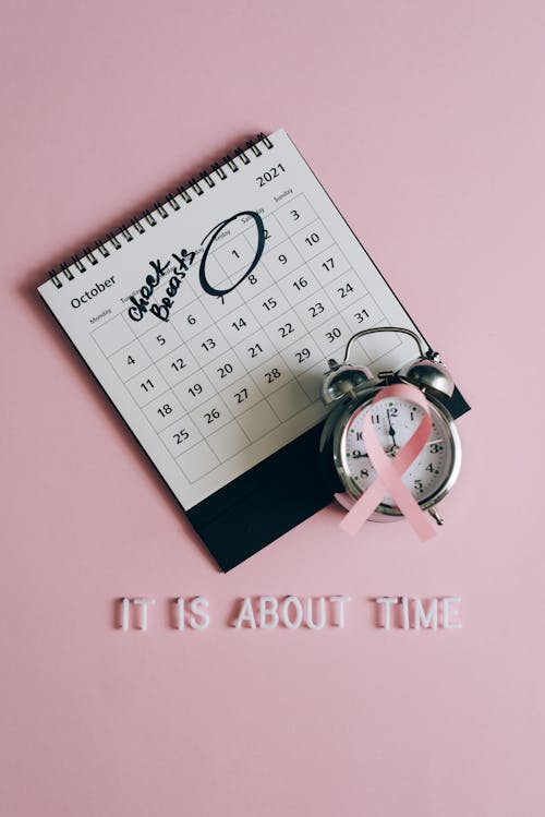 Free Close-Up Shot of a Pink Ribbon beside a Calendar Stock Photo