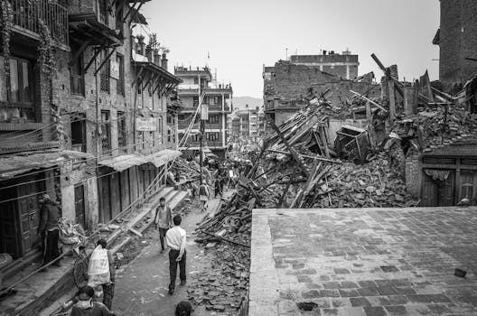 Devastation in Bhaktapur, Nepal following a major earthquake, showing rubble and damaged buildings.