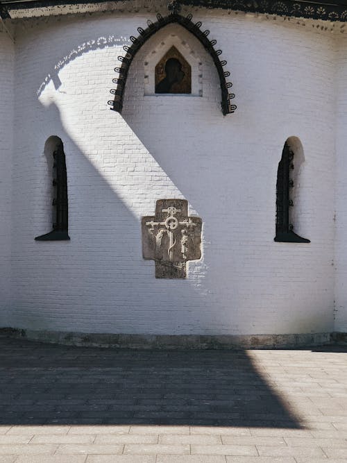 Facade of an Ancient White Wall Church 