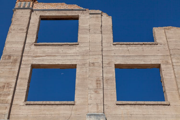 Low Angle View Of The Last Standing Wall Of A Destroyed Building 