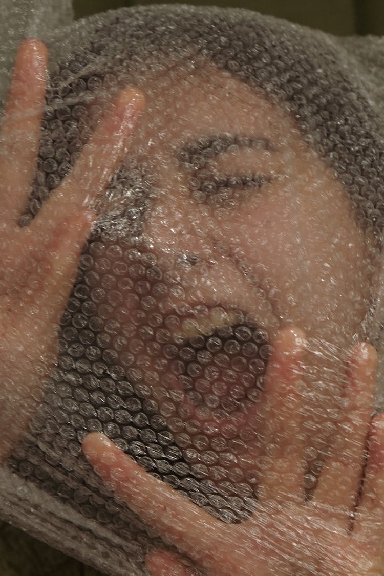 A Woman Wrapped In Plastic Bubble Wrap