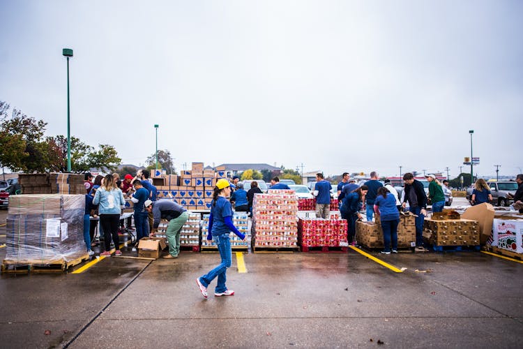 People Taking Containers With Cargo In Terminal Port