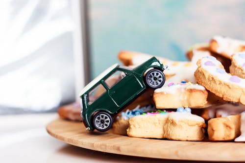 A Close-Up Shot of a Toy Car and Cookies