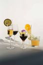 Cocktails with lemon and orange in glasses