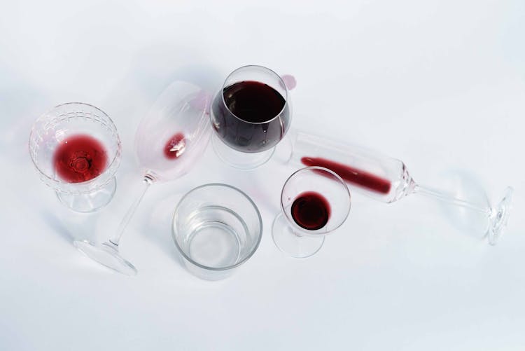 Wineglasses With Red Wine On White Table