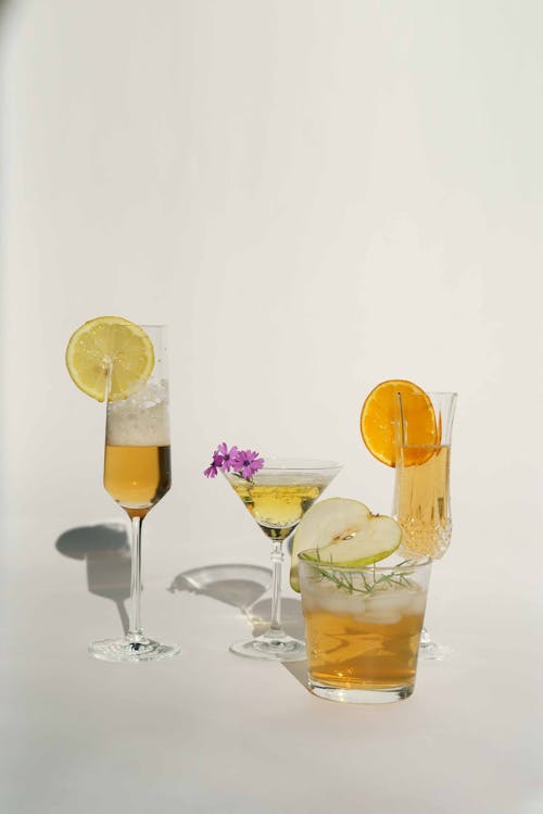 Free Refreshing cocktails served with lemon pear and orange Stock Photo