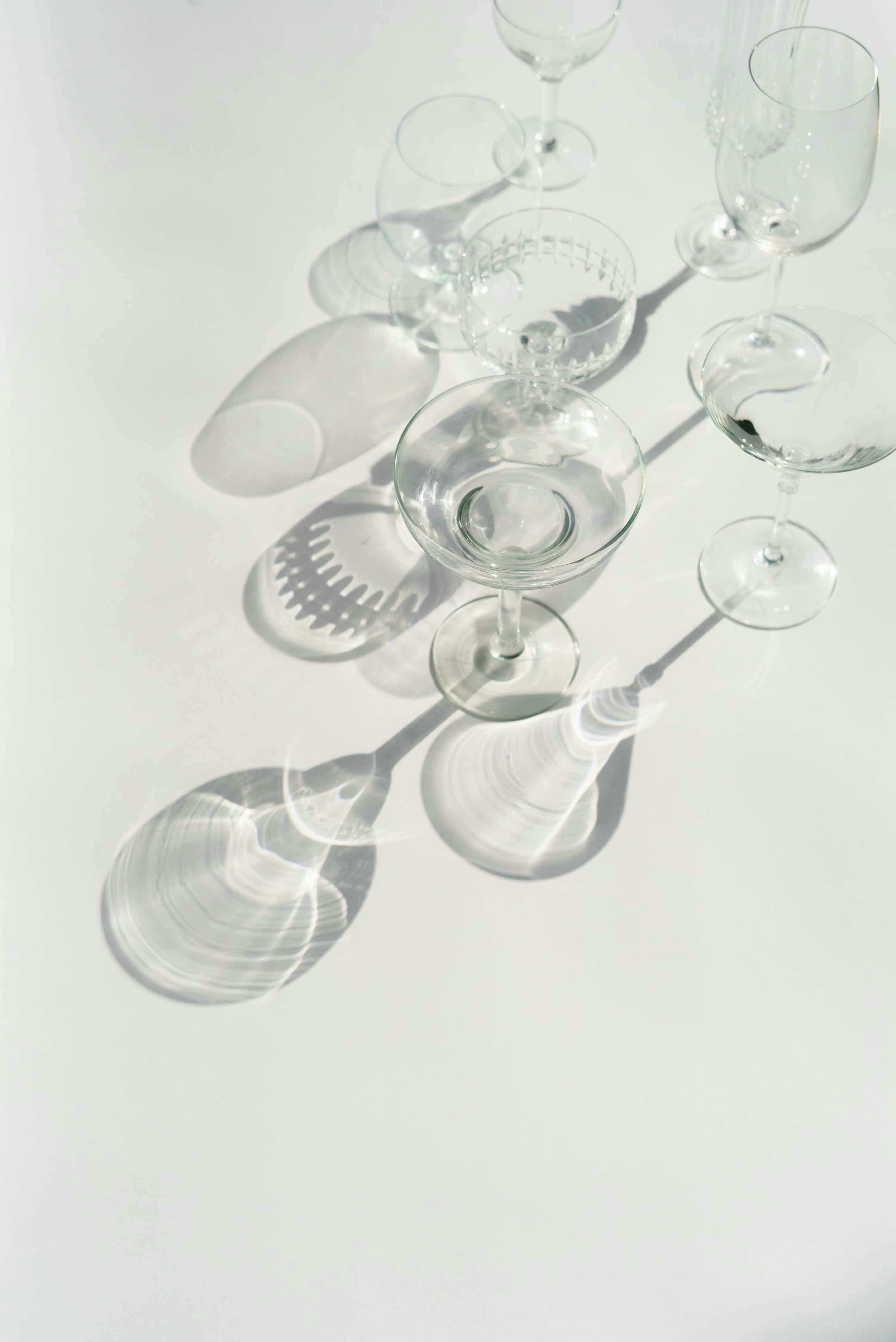 set of transparent glassware on white table