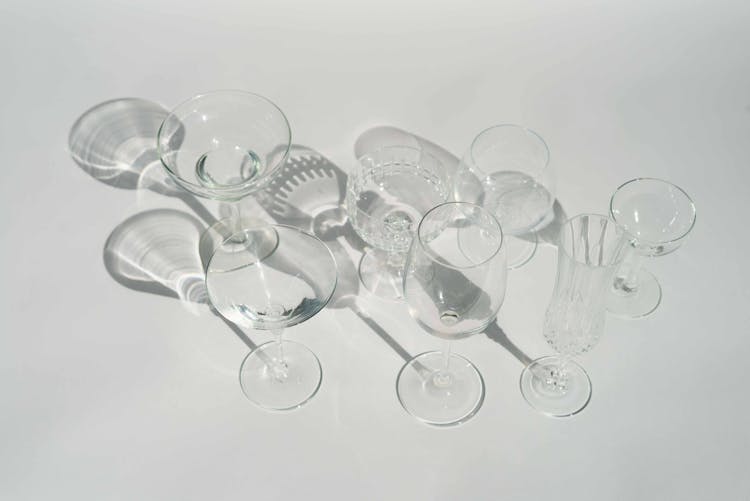 Different Clean Glassware In White Studio