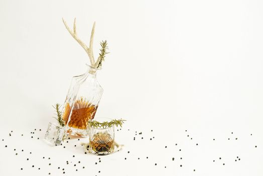 Glass and decanter with whiskey