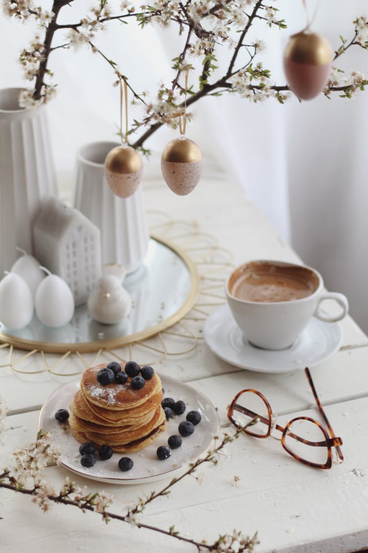 Blueberry Pancakes Near Cup Of Coffee During Easter Holiday