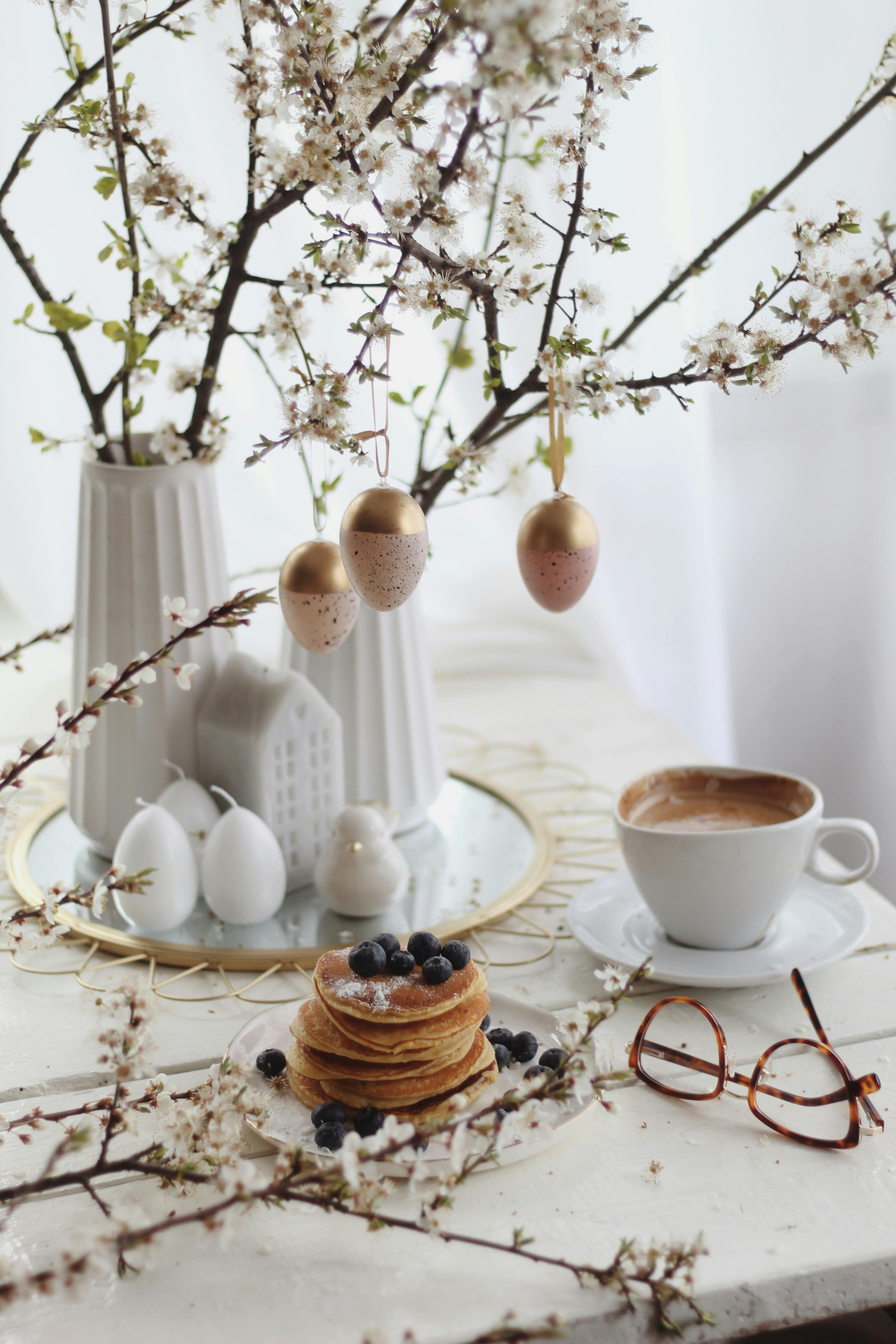 Pancakes with bananas near Easter decorations · Free Stock Photo