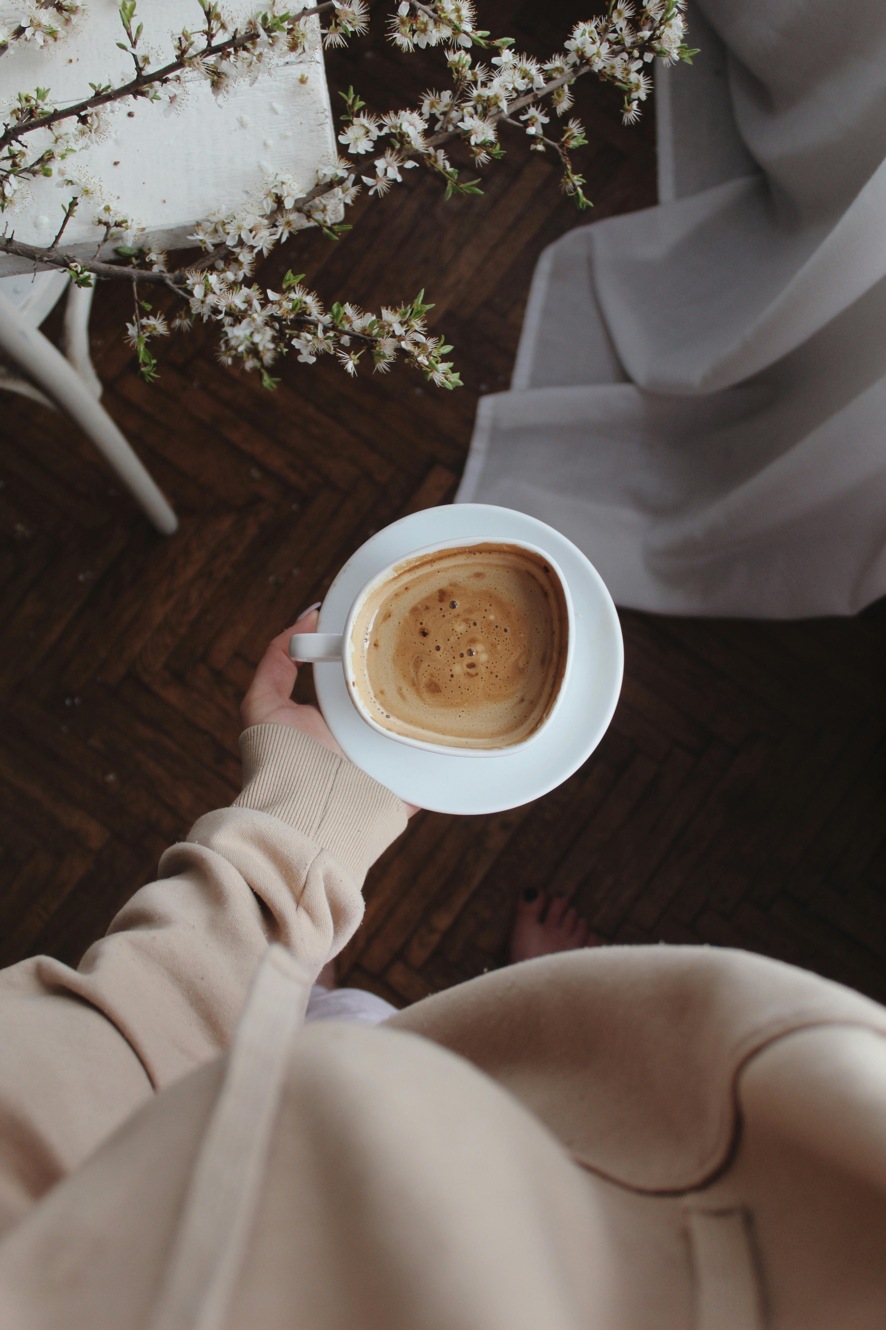 unrecognizable woman with cup of coffee