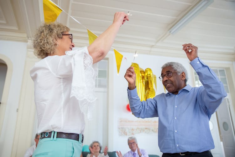 Elderly Man And Woman Dancing