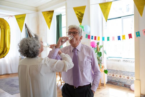 Elderly Couple Drinking Champagne Together