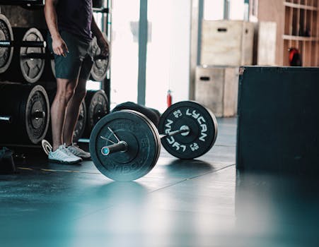 Close-up of a barbell in a gym, ready for a strength-training session.