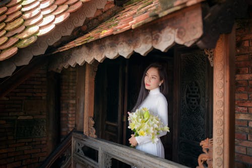 Beautiful Woman Holding Flowers