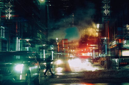 Free Blurred Shot of People and Cars on the Street during Night Time Stock Photo