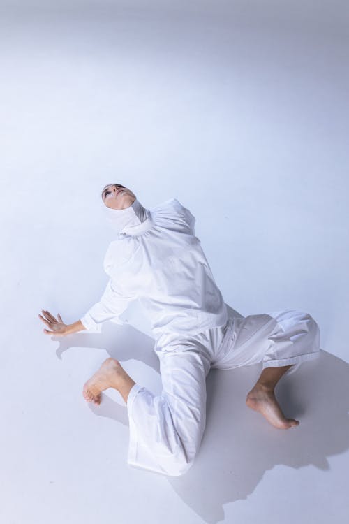 Woman in White Clothes on the Floor