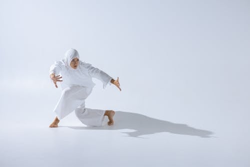 Woman in White Hijab Dancing
