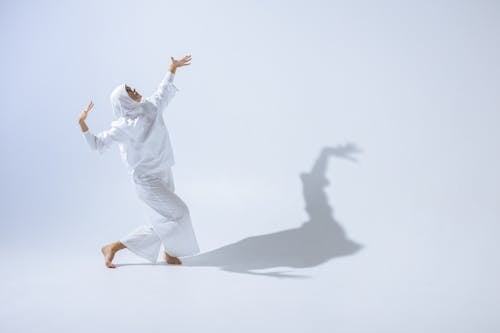 Woman in White Clothes Dancing