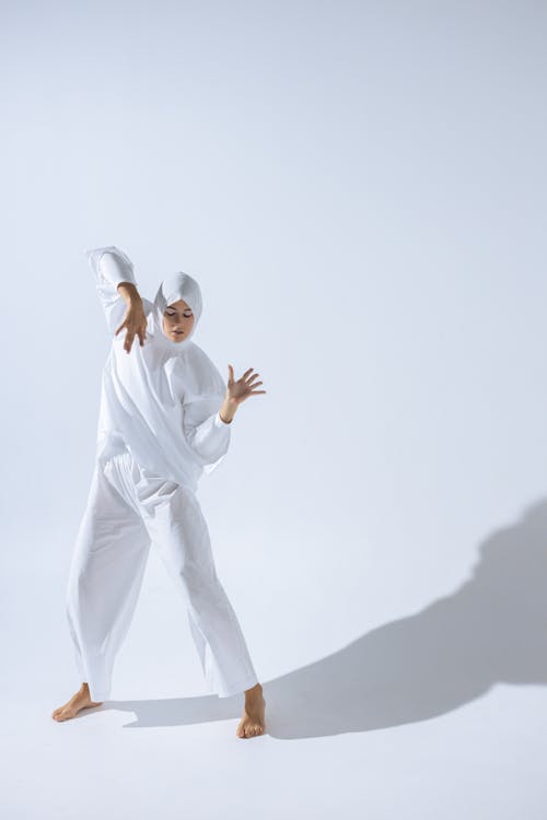 Woman in White Clothes Dancing