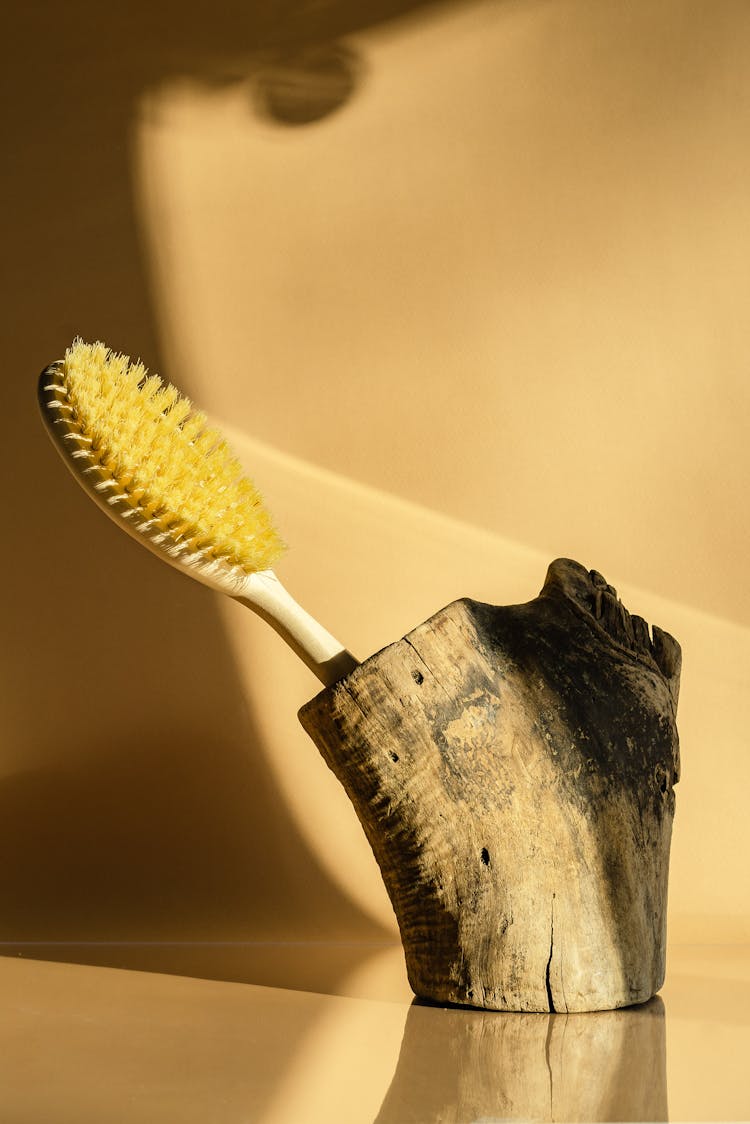 A Yellow Brush On A Wood