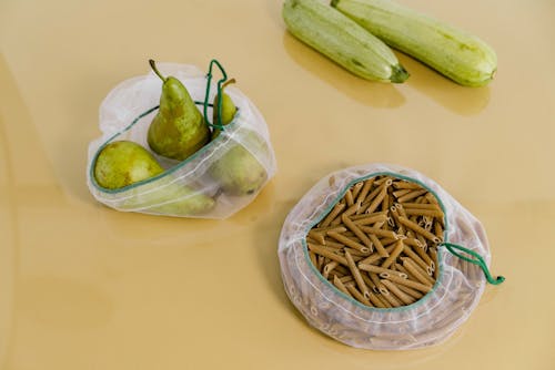 Uncooked Pasta Near Green Pears and Zucchini 