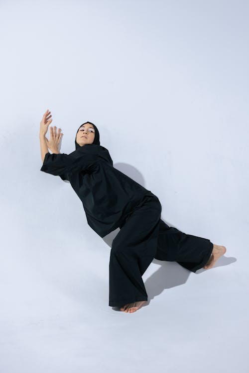 Woman in Black Hijab Dancing